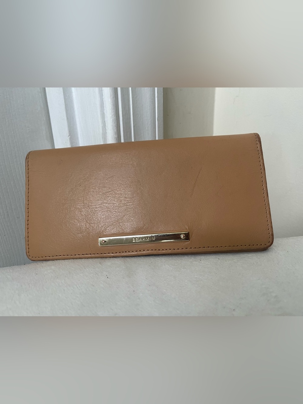 Brahmin tan leather continental wallet with gold-tone logo